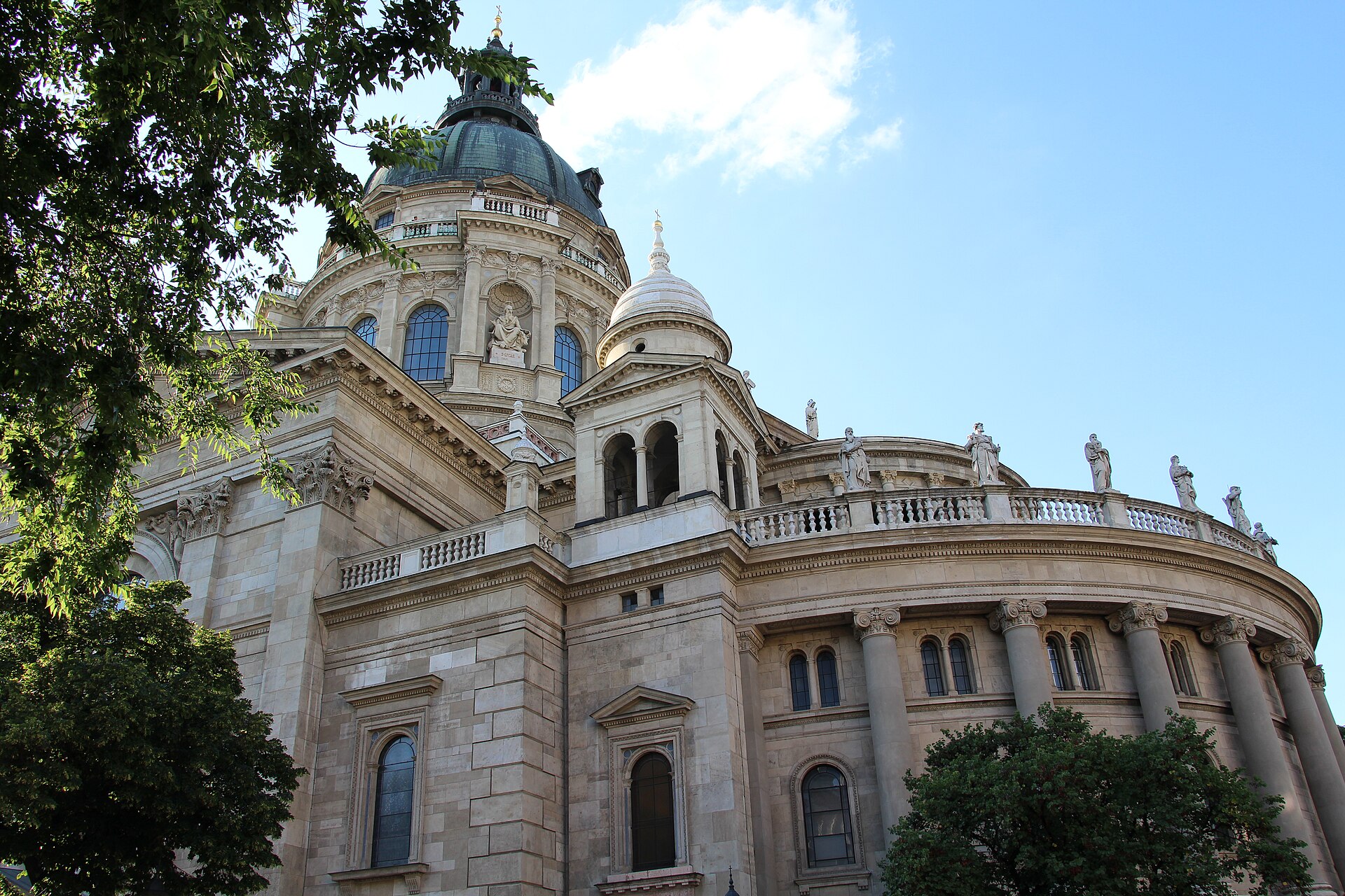 The green dome, statue-lined balustrade and neo-classical colonnade of St Stephen’s Basilica in Budapest’s District V.