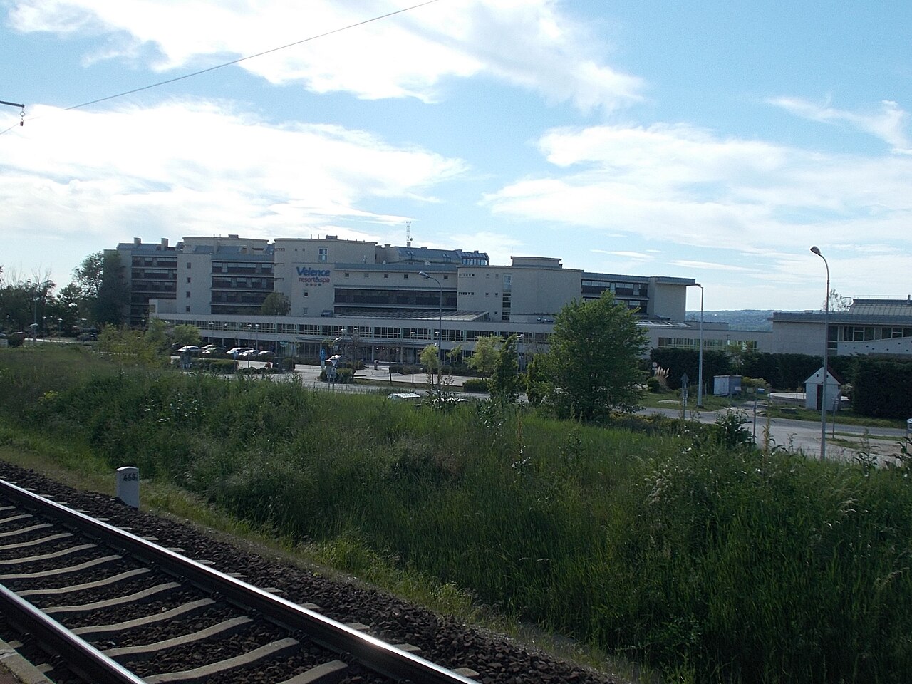 The railway halt at Velence with the Velence Resort and Spa buildings visible directly behind the platform