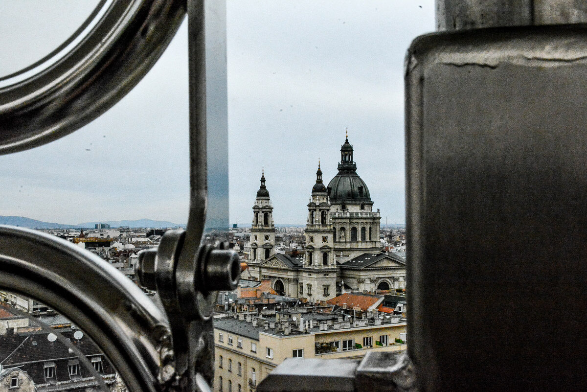 St Stephen’s Basilica’s dome and towers seen through the frame of a Ferris Wheel of Budapest cabin