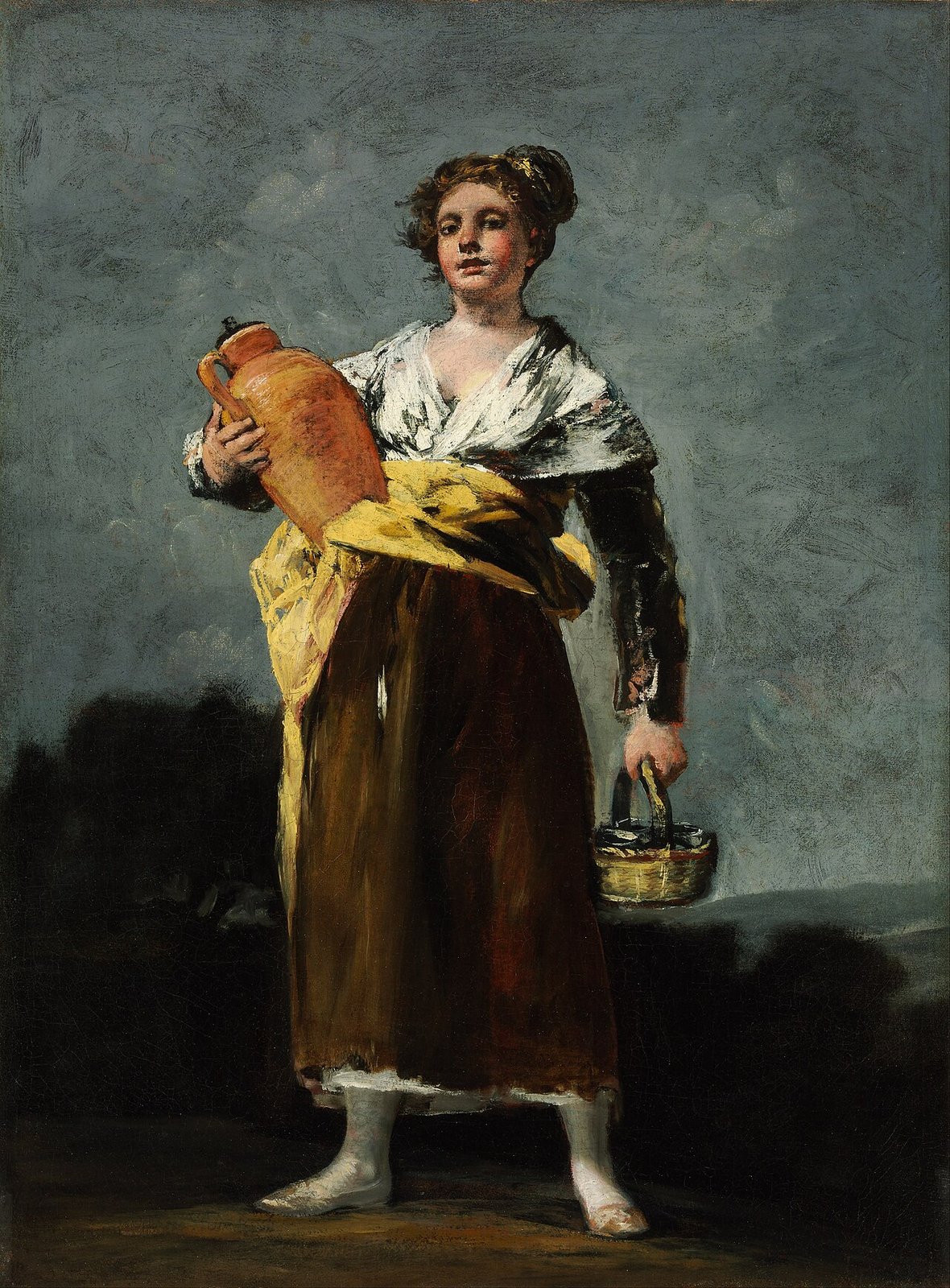 Goya’s The Water Carrier: a young woman in a white shawl, yellow sash and brown skirt holding an orange clay jug at her side and a small basket in her other hand, against a gray sky
