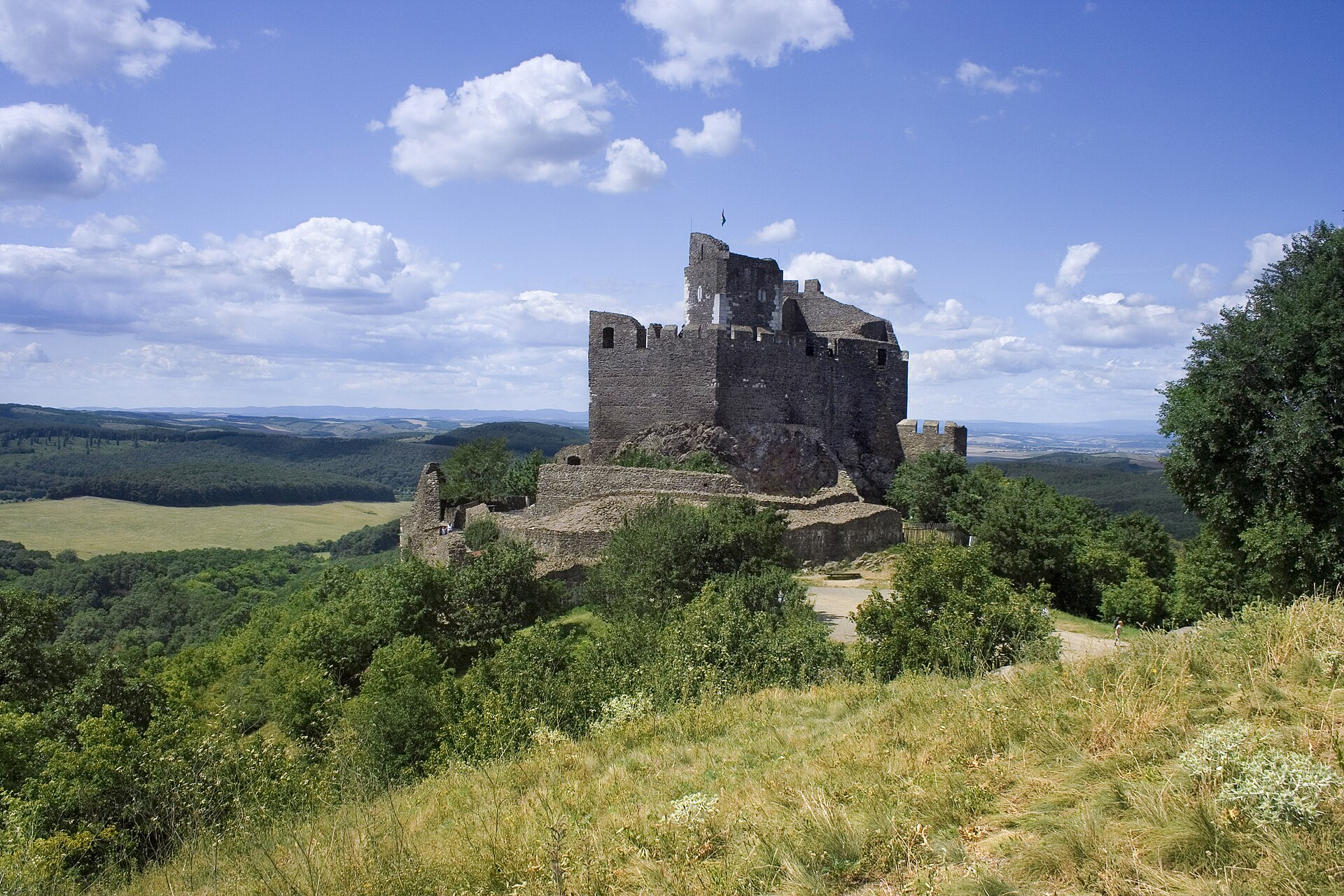 Hollókő Castle, a stone keep on a hilltop above the Nógrád countryside