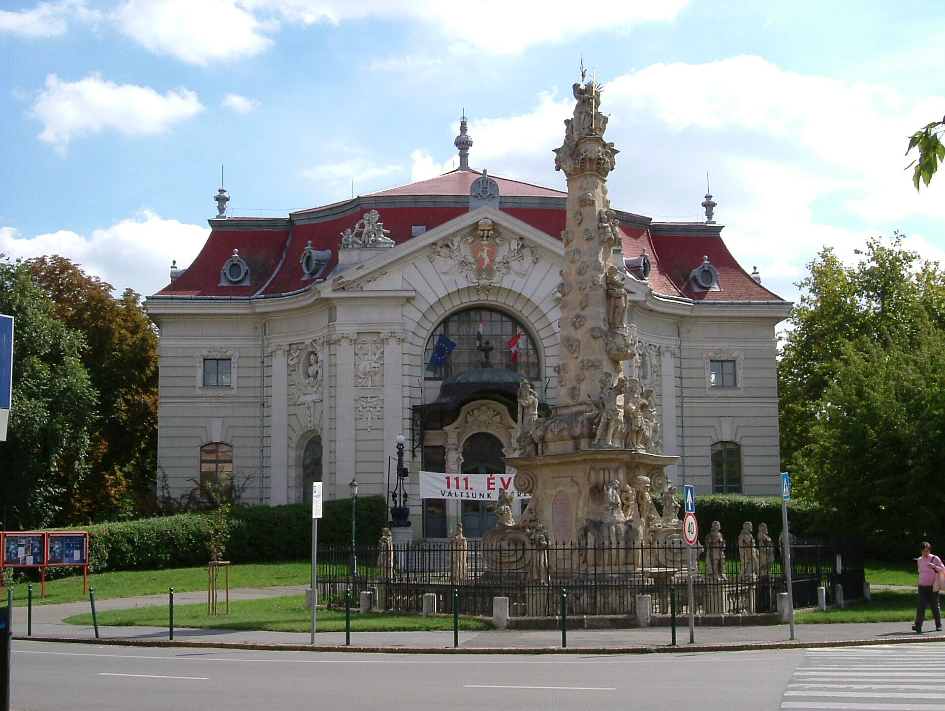 The Katona József National Theater in Kecskemét, with the Holy Trinity column in front