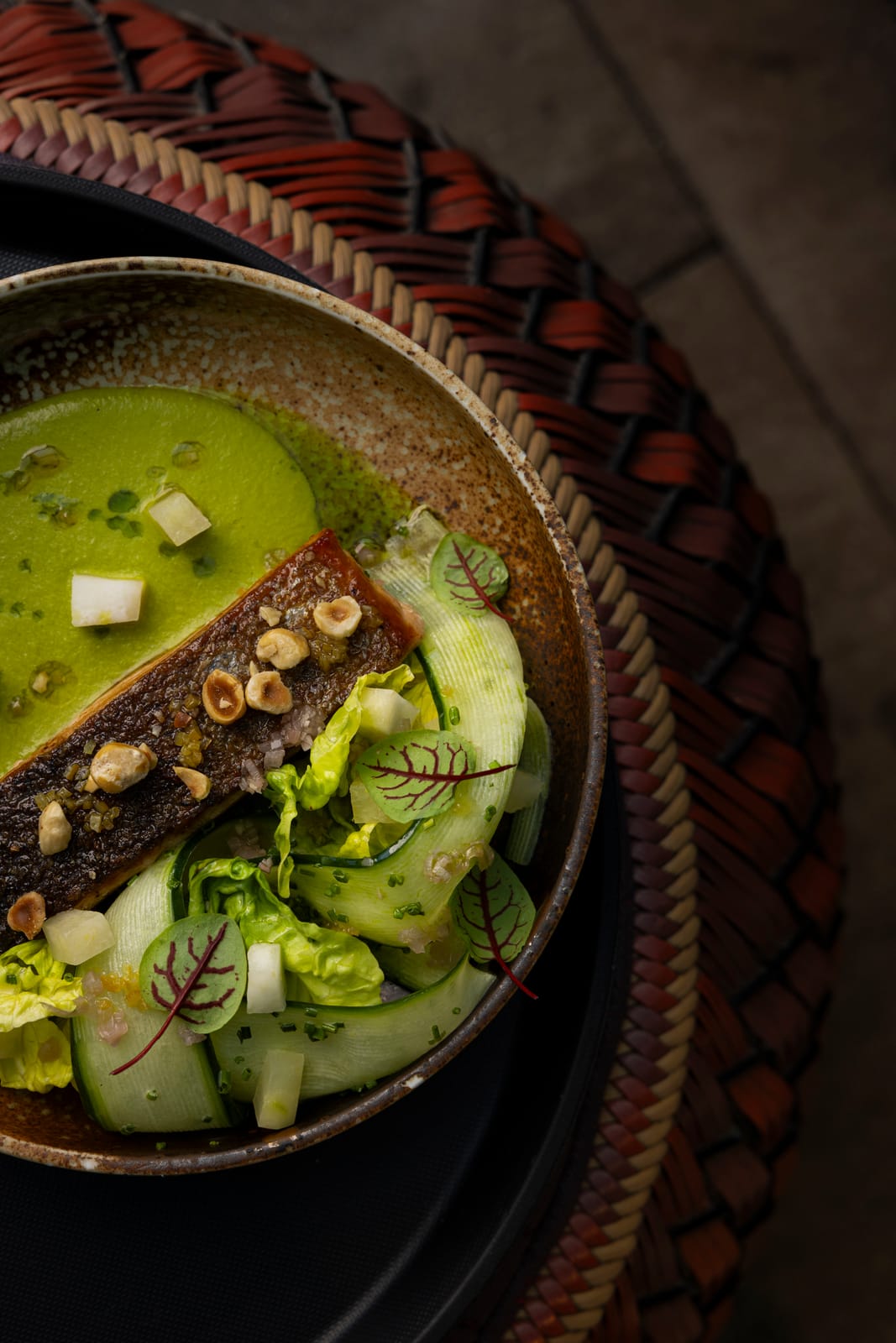 Crisp-skinned fish fillet with hazelnuts, cucumber ribbons and a green sauce at Leo Rooftop