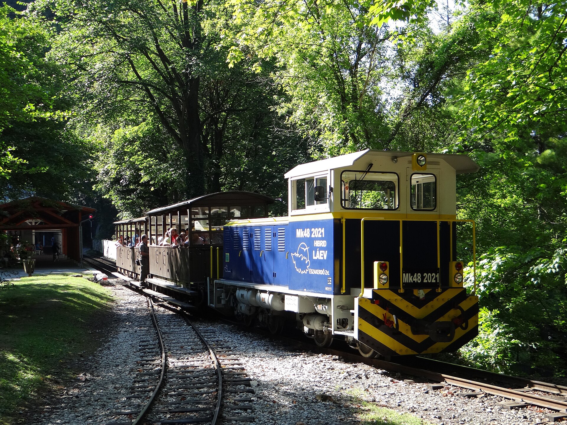 A Lillafüred forest railway train with open carriages at the station in Lillafüred