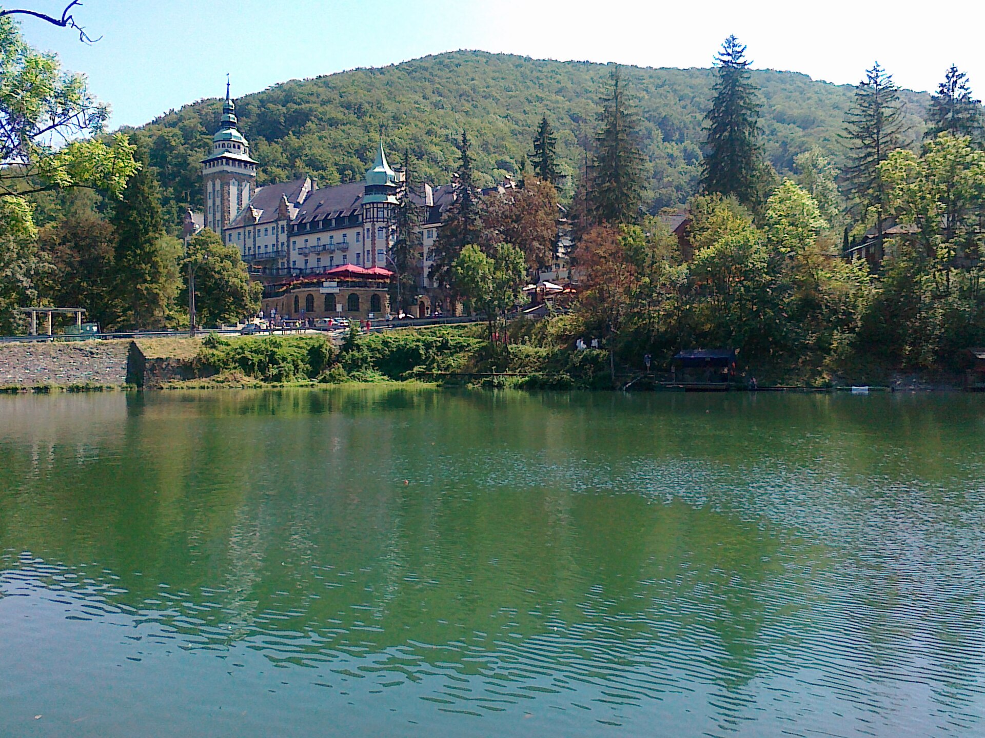 The Palace Hotel at Lillafüred seen across Lake Hámori, with the wooded Bükk hills behind it