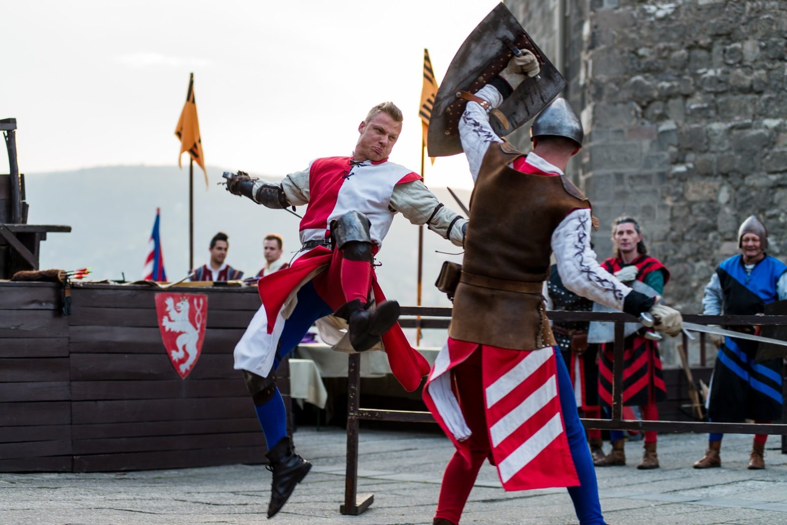 Two costumed knights fighting with sword and shield at the Visegrád knights’ tournament show