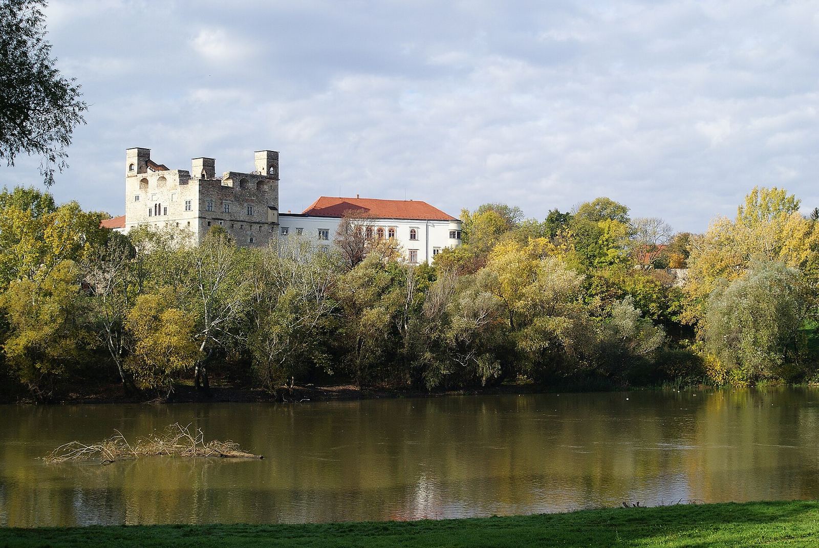 The Rákóczi Castle in Sárospatak with the Red Tower, seen across the Bodrog river in autumn