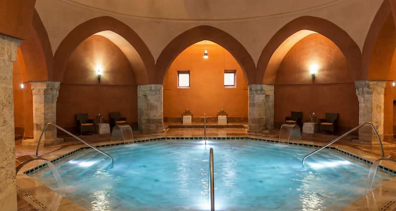 Veli Bej Bath Budapest interior showing the authentic Ottoman thermal pool under the historic dome